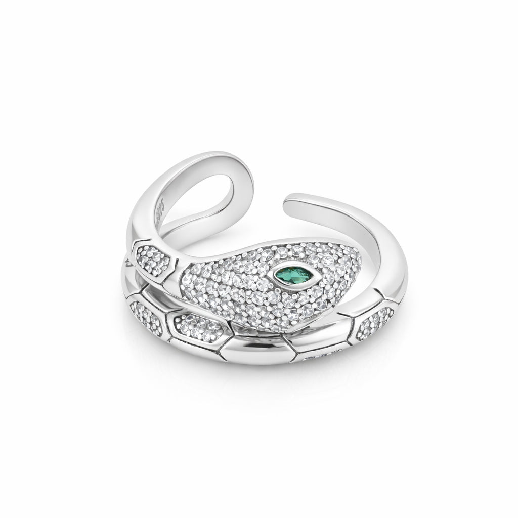Silver ring with green gemstone on a white background