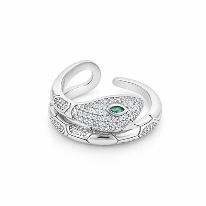 Silver ring with green gemstone on a white background