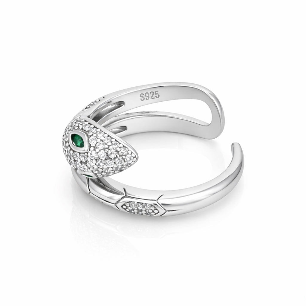 Silver ring with green gemstone on a white background