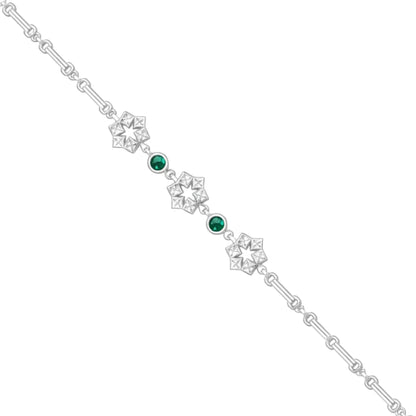Silver bracelet with green gemstones on a white background