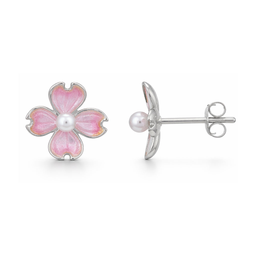 Flower-shaped earrings with pink enamel and pearl center on a white background