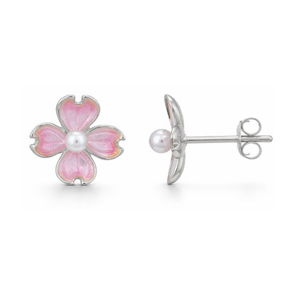 Flower-shaped earrings with pink enamel and pearl center on a white background