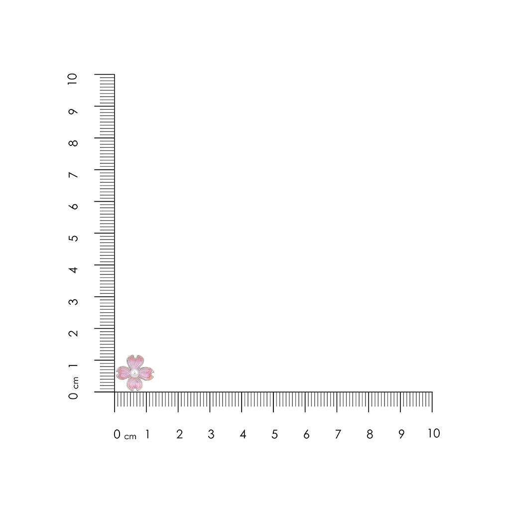 Small pink flower next to a ruler on a white background