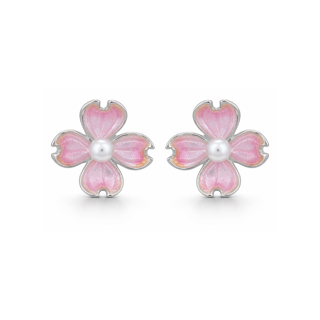 Pink flower-shaped earrings with a central pearl on a white background