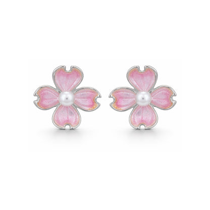 Pink flower-shaped earrings with a central pearl on a white background
