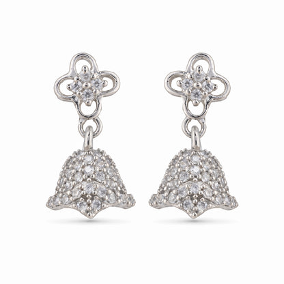 Silver earrings with floral top and bell-shaped bottom on a white background