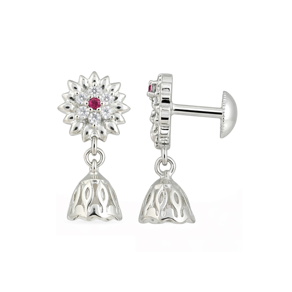 Silver earrings with floral design and red gemstone on a white background