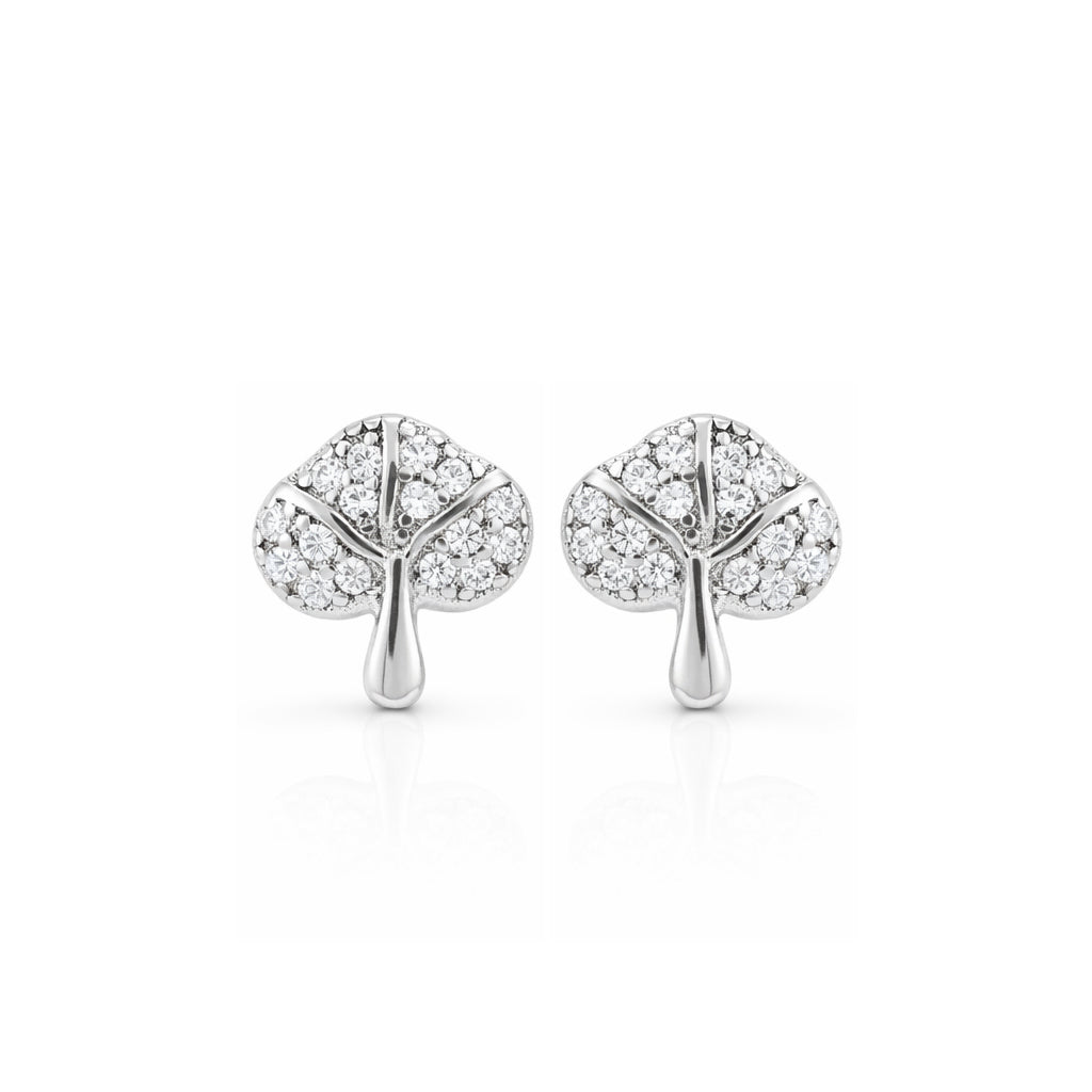 Tree-shaped silver earrings with clear gemstones on a white background