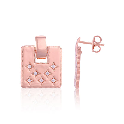 Rose gold earring with star designs on a white background