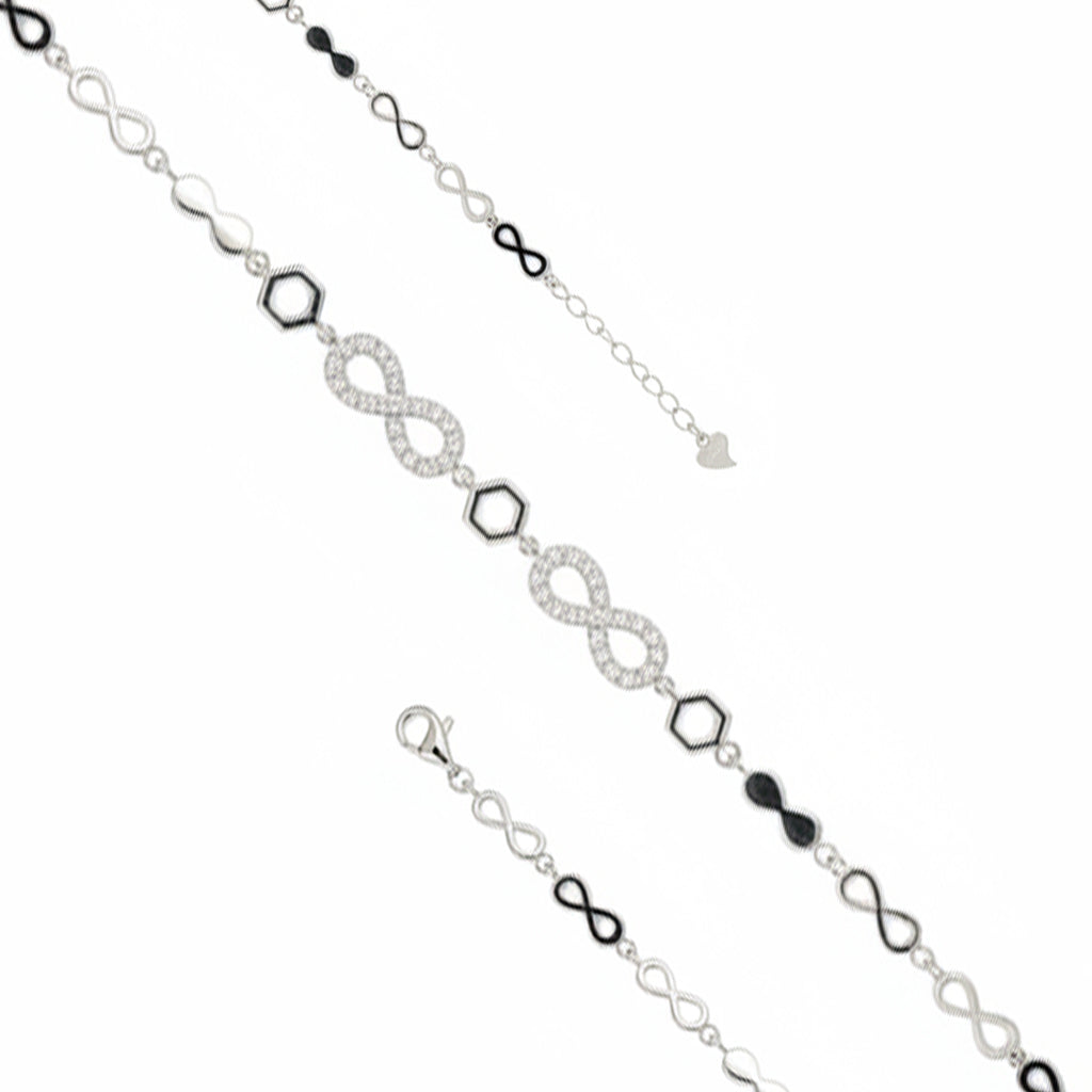 Silver bracelet with infinity符号and black beads on a white background