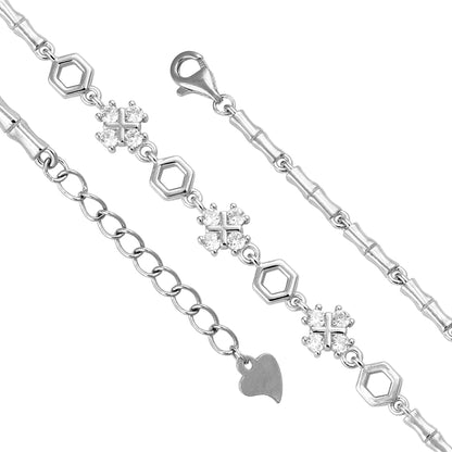 Silver bracelet with heart and hexagon charms on a white background