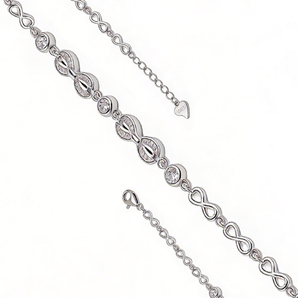 Silver bracelet with interlocking heart and infinity symbol links on a white background