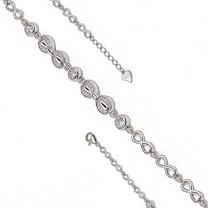 Silver bracelet with interlocking heart and infinity symbol links on a white background