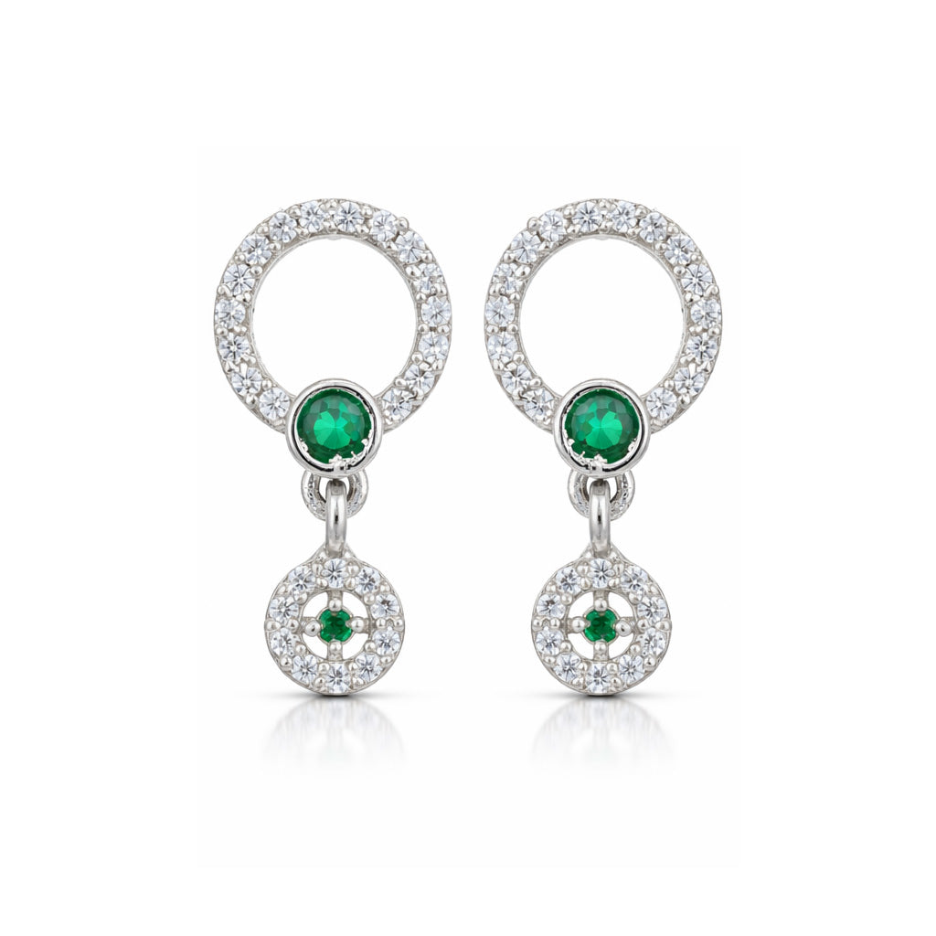 Pair of earrings with emerald stones and diamond accents on a white background