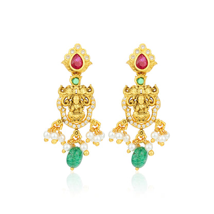 Gold earrings with gemstones and pearls on a white background
