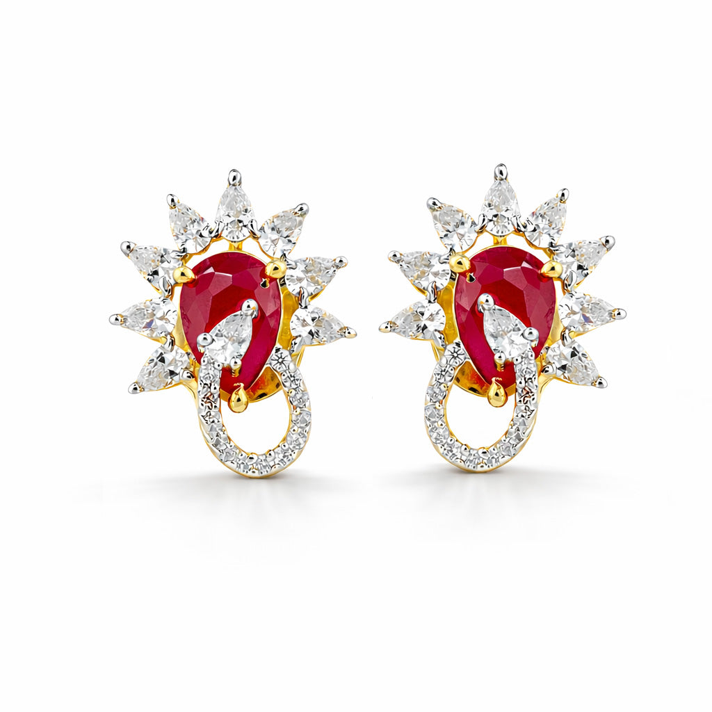 Pair of earrings with red gemstones and diamond-like stones on a white background