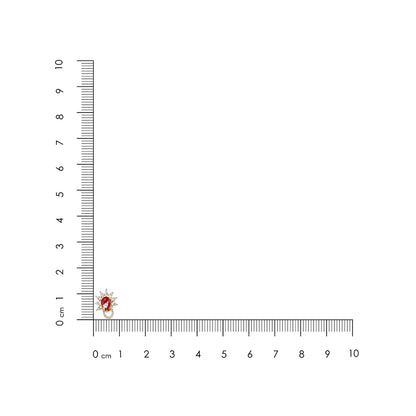 Small red and white object next to a ruler on a white background