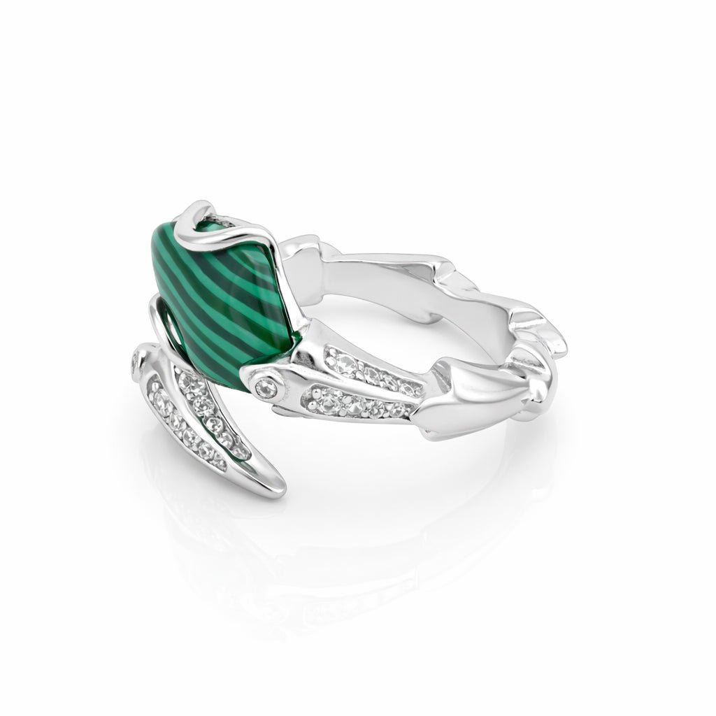 Silver ring with a green gemstone on a white background