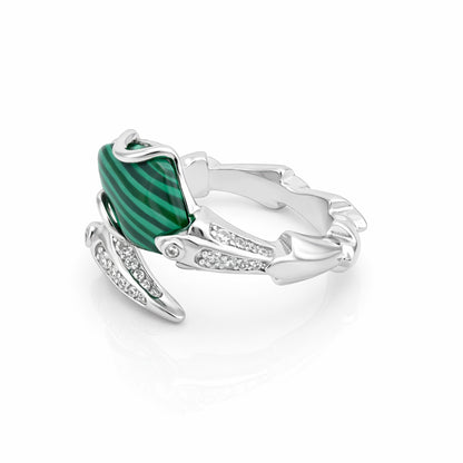 Silver ring with a green gemstone on a white background