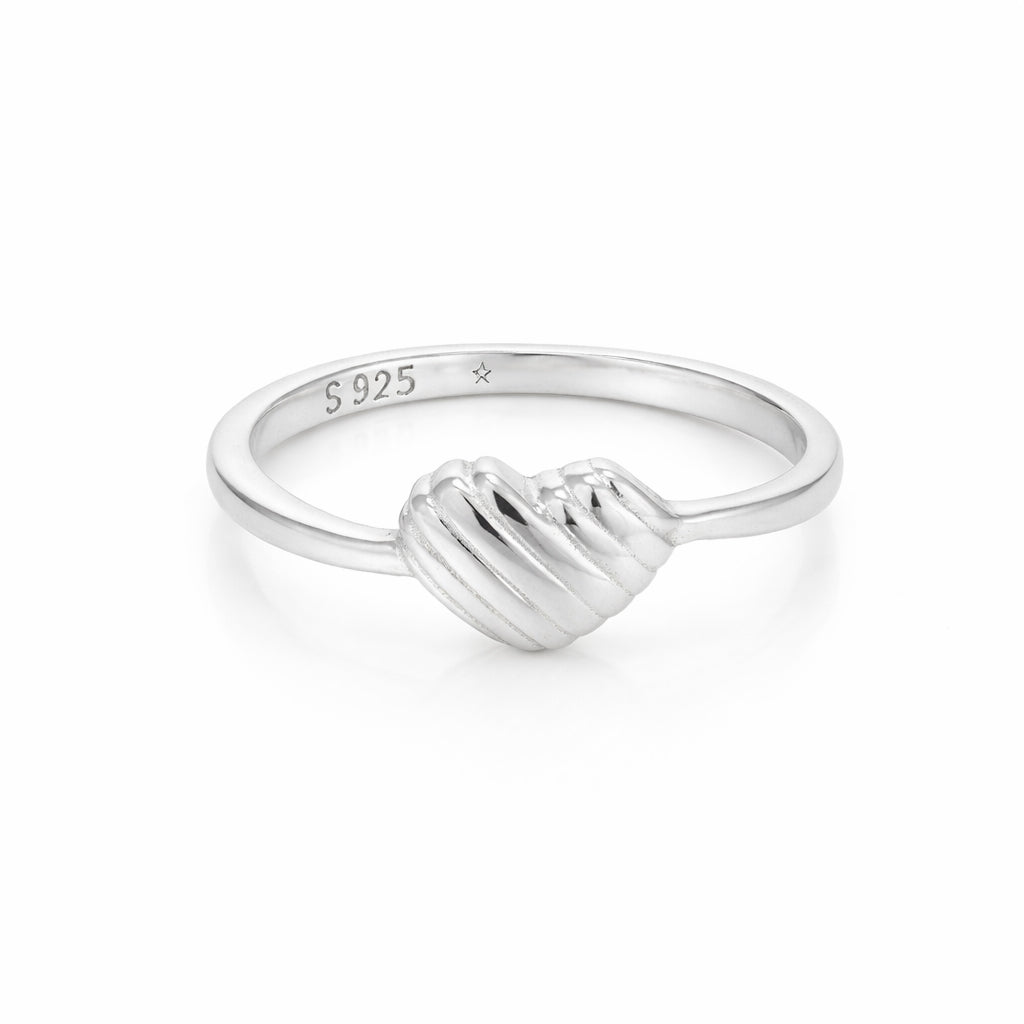 Silver ring with a wave design on a white background