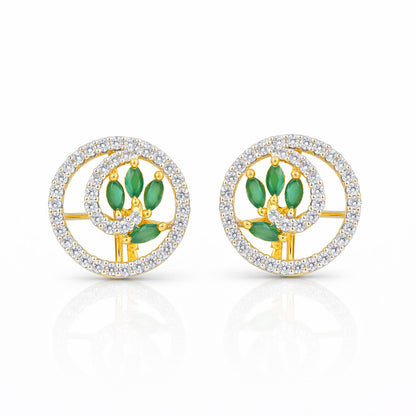 Pair of earrings with green gemstones and gold accents on a white background