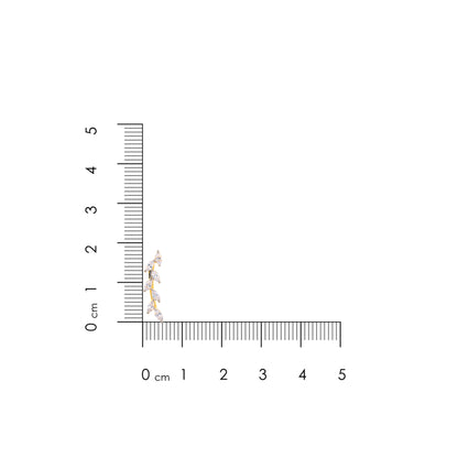 Jewelry with a ruler for scale on a white background