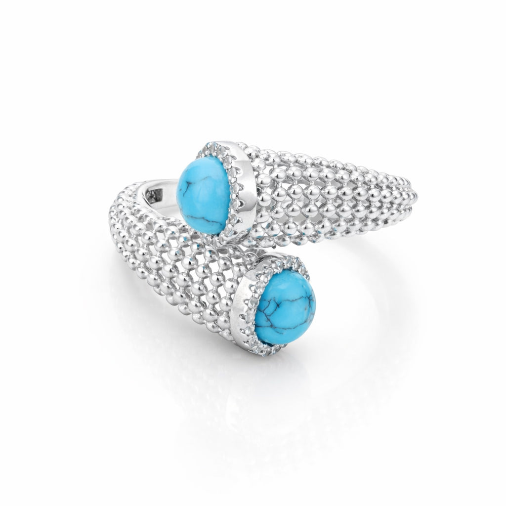 Silver ring with turquoise stones on a white background