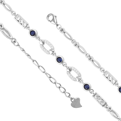 Silver bracelet with blue gemstones and heart charm on a white background