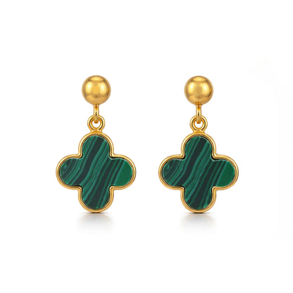 Gold earrings with green clover-shaped drops on a white background
