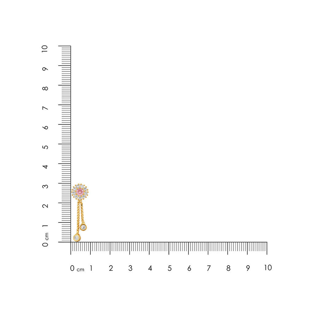 Earring with a small pink gemstone and pearl next to a ruler for scale on a white background