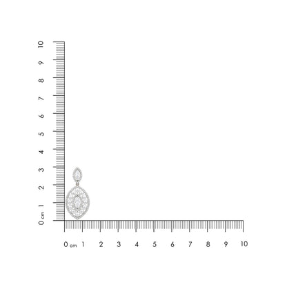 Silver pendant with a clear gemstone next to a ruler on a white background