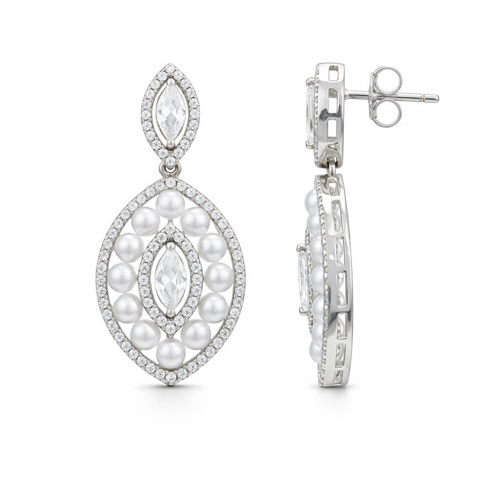 Pearl and diamond earrings on a white background