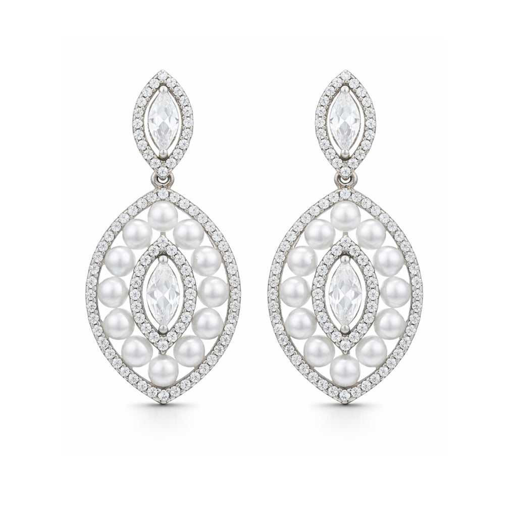 Pair of pearl and diamond earrings on a white background