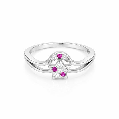 Silver ring with star design featuring pink gemstones on a white background