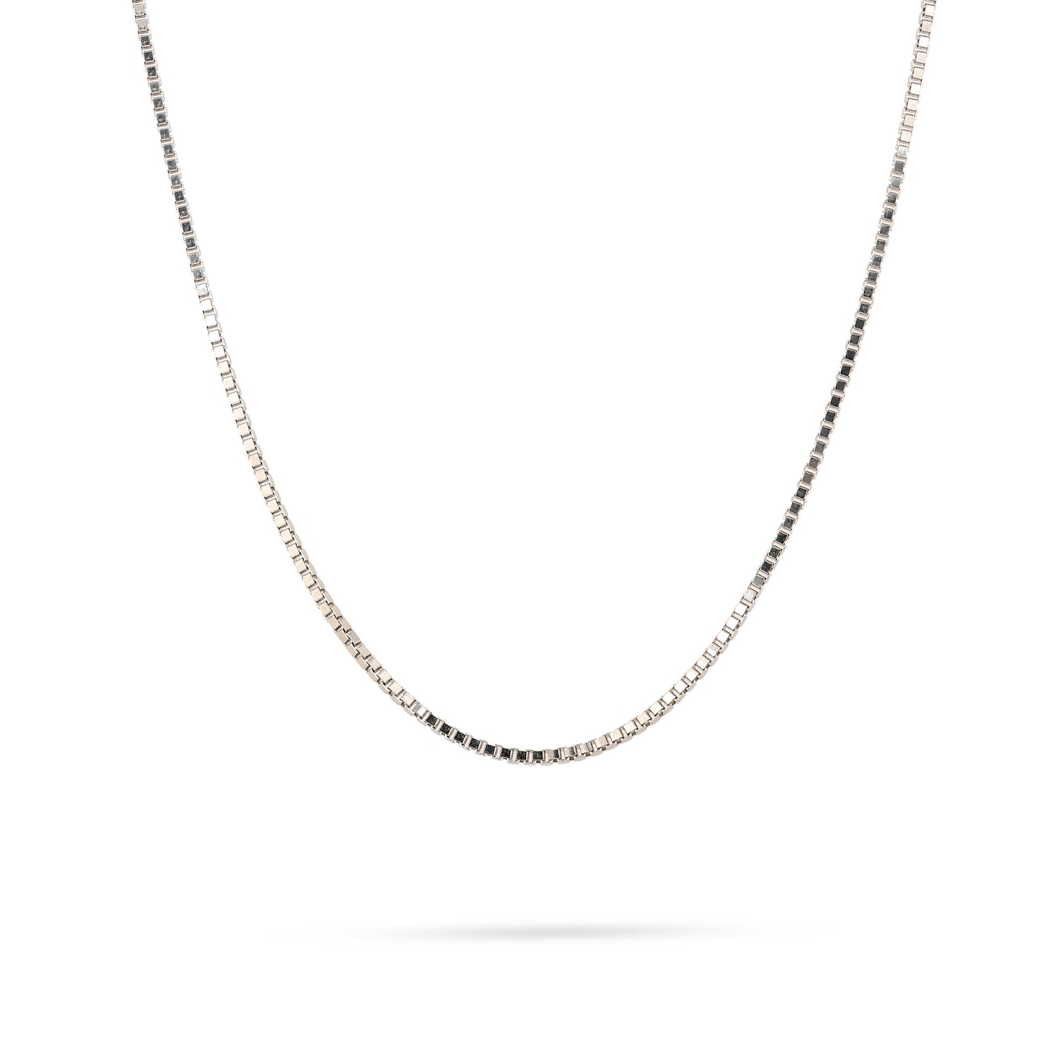 Silver chain necklace on a white background