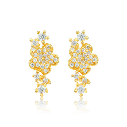 Gold floral earrings with clear gemstones on a white background