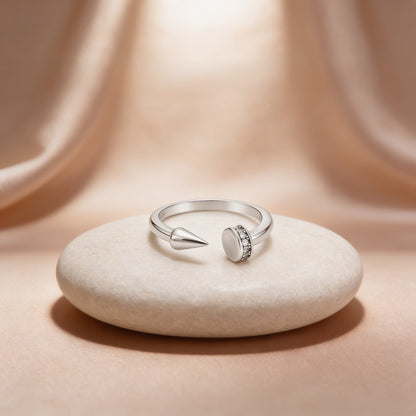 Silver ring with a unique design on a beige stone
