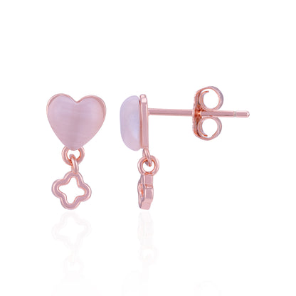 Pair of earrings with pink heart and star charms on a white background