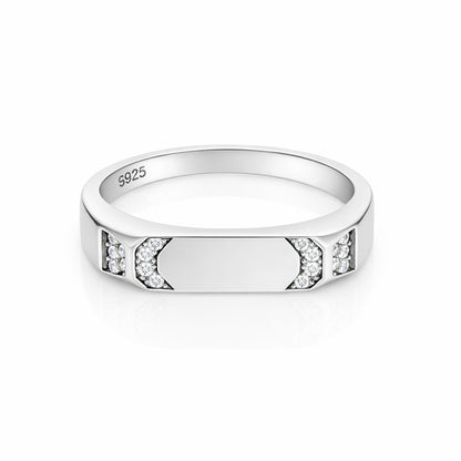Silver ring with embedded diamonds on a white background