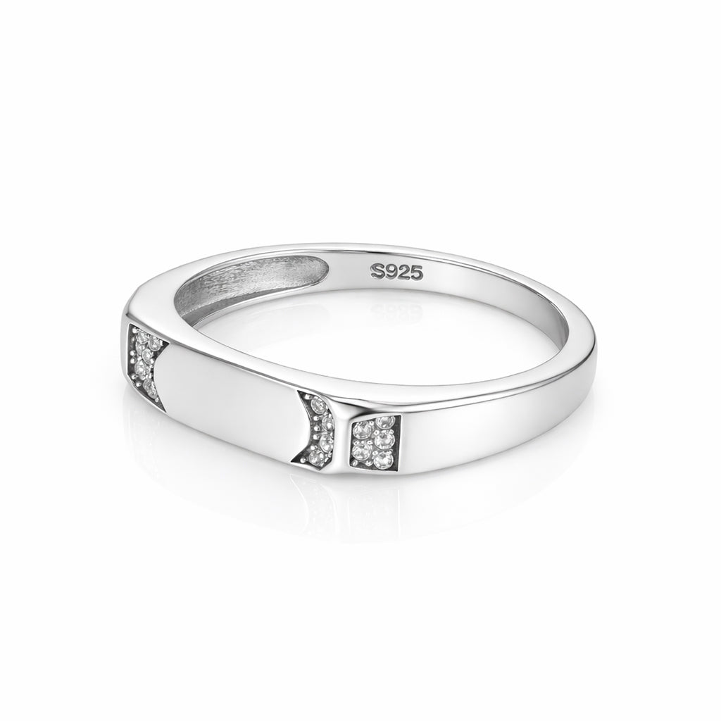 Silver ring with embedded diamonds on a white background