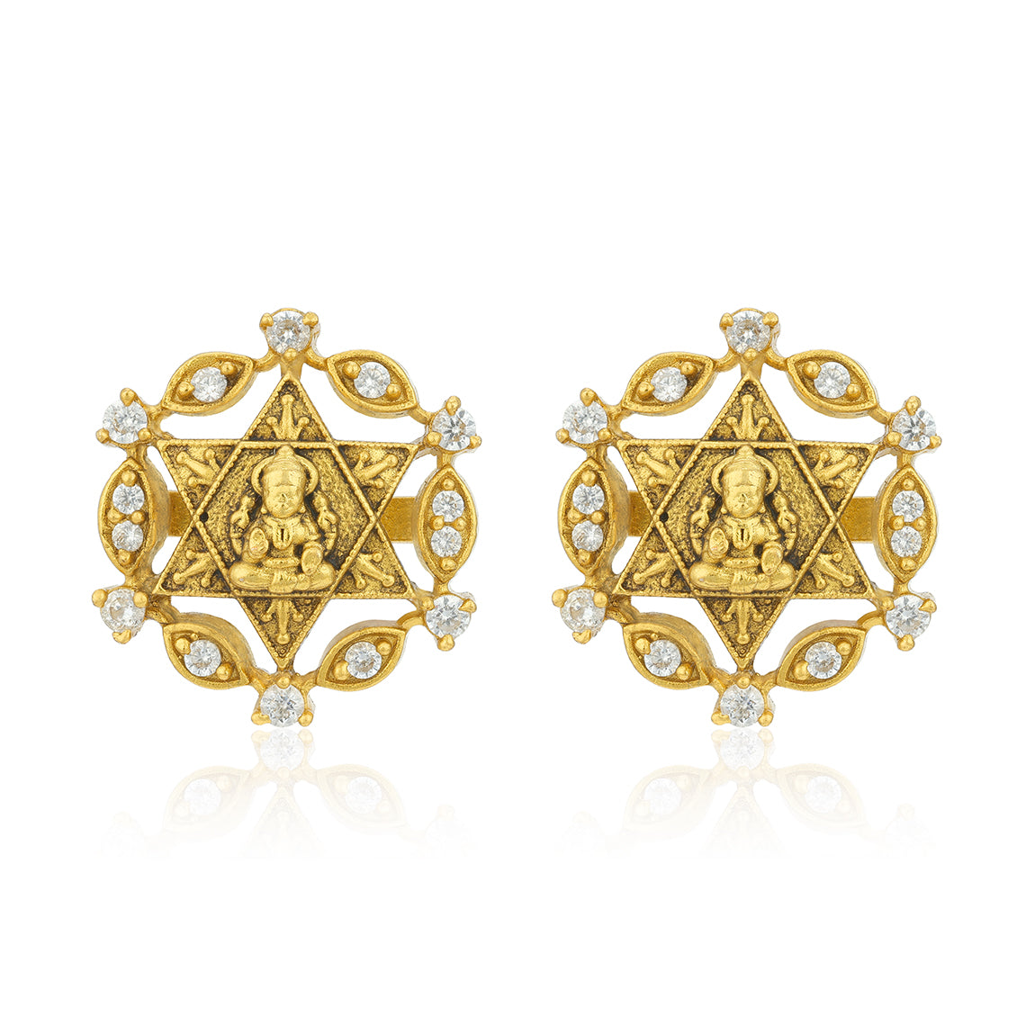 Gold earrings with star design and embedded stones on a white background