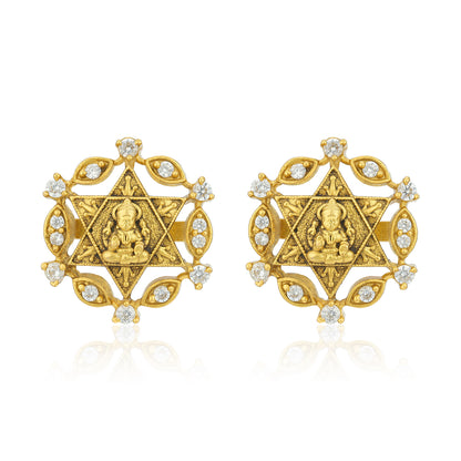 Gold earrings with star design and embedded stones on a white background