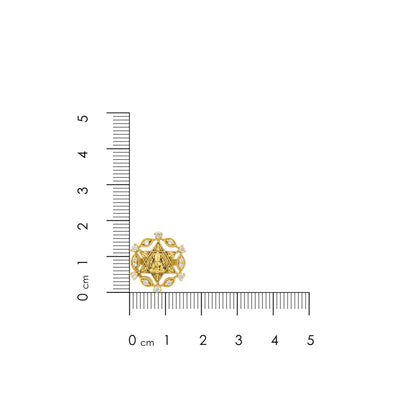 Gold pendant next to a ruler on a white background