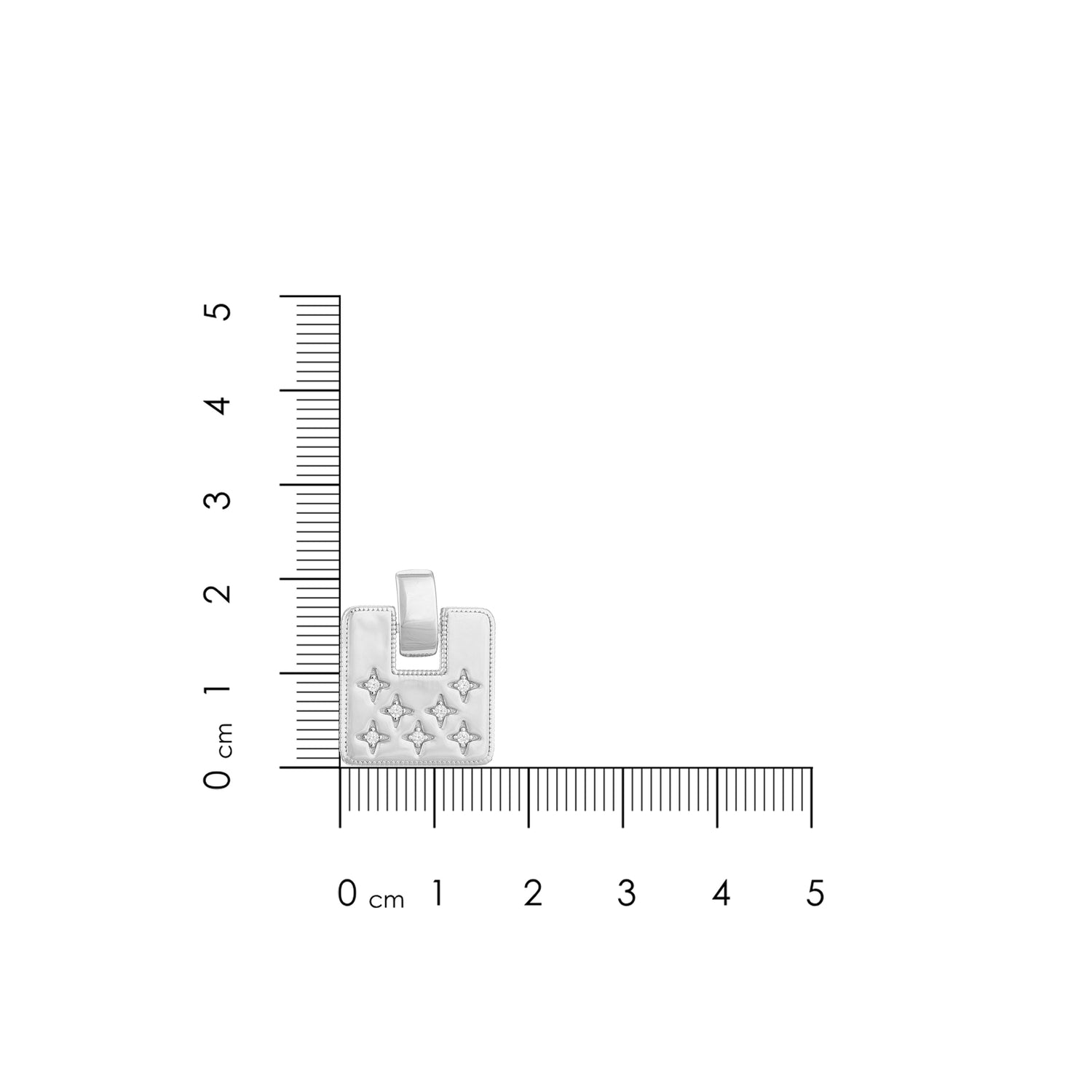 Silver pendant with cut-out design on a white background with measurement scale
