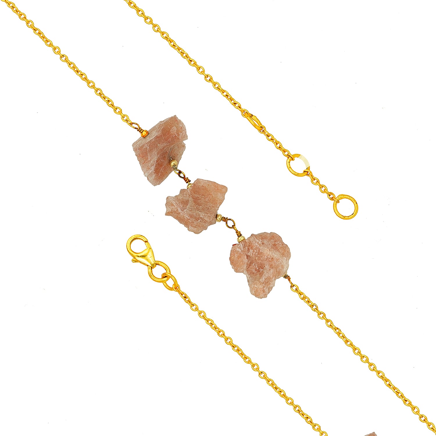 Gold chain necklace with natural stone pendants on a white background