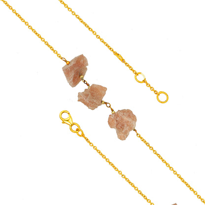 Gold chain necklace with natural stone pendants on a white background