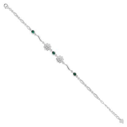 Silver bracelet with green gemstones on a white background