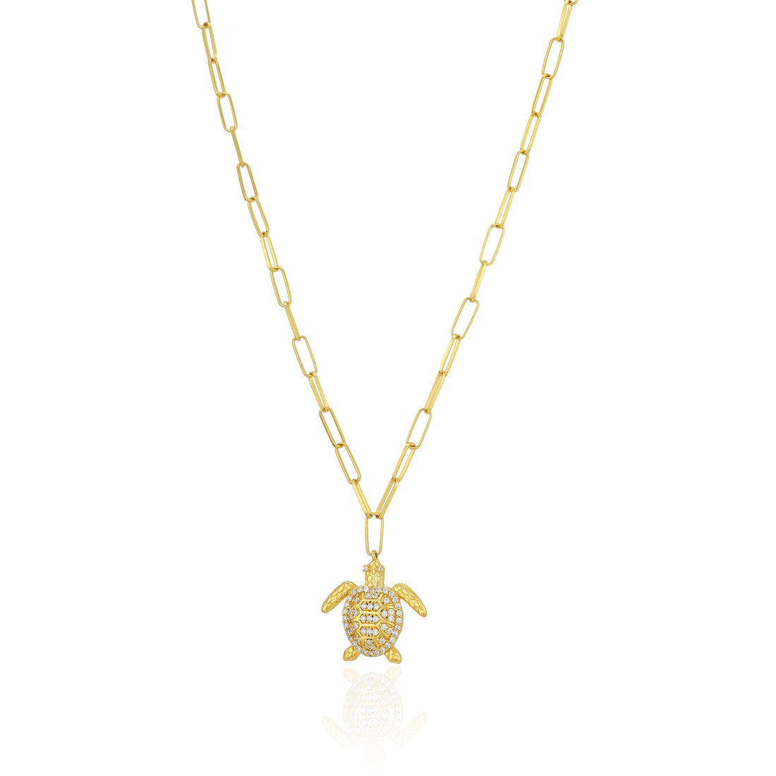Gold turtle pendant necklace on a white background