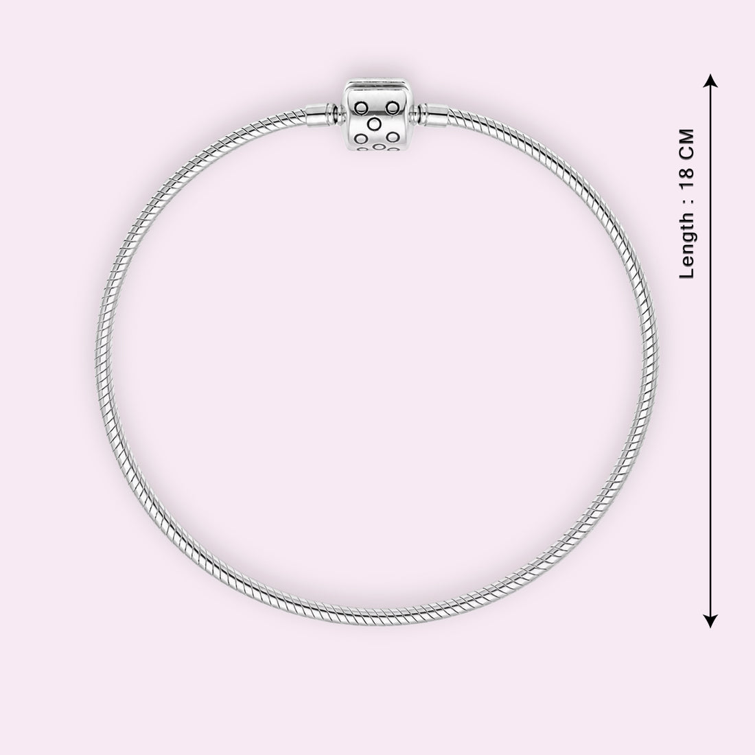 Silver bracelet with a clasp on a light pink background