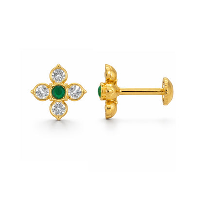 Gold earrings with green gemstones and clear stones on a white background